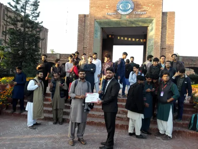 Usman Saeed awarding a participation certificate to a student at COMSATS Lahore