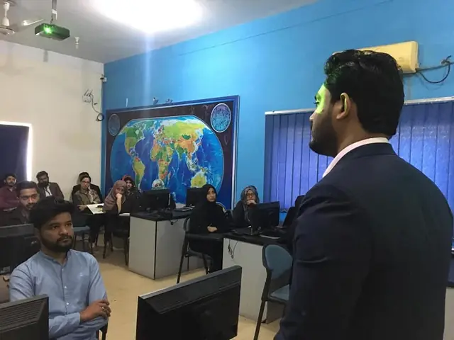 Usman Saeed addressing trainees in a Kamyab Jawan Programme computer lab