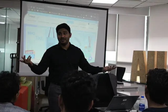 Usman Saeed explaining a live walkthrough on screen at Nexskill, Lahore