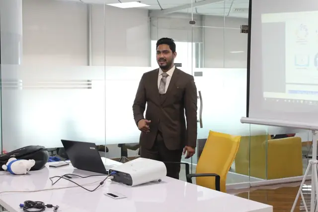 Usman Saeed teaching digital marketing at the front of a Nexskill classroom