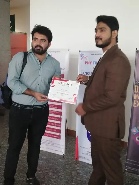 Usman Saeed presenting a course certificate at PNY Trainings, Arfa Tower, Lahore