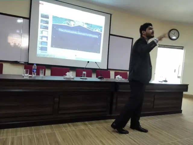 Usman Saeed presenting a digital marketing lecture in a seminar room